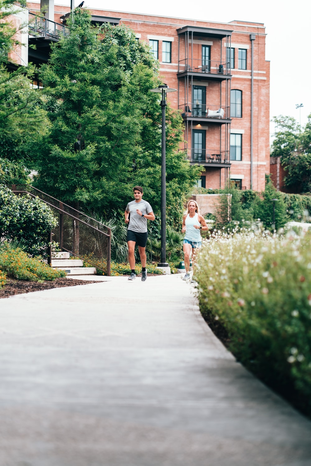 man and woman on path jogging